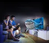 A family is watching a 3D movie with a shark coming out of the screen. Produktbild-Vorschau