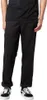 A person wearing black Dickies work pants and black sneakers. Náhled obrázku produktu