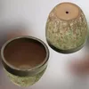 Two ceramic pots, one upright and one on its side, against a light background. Anteprima dell’immagine prodotto