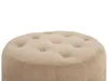 A close-up view of a round, tufted pouf. Náhled obrázku produktu