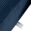 A close-up view of the textured fabric of a navy blue sofa, showing the ribbed pattern and two white plastic clips attached to the underside. Produktbild-Vorschau
