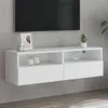 A white wall-mounted TV cabinet with two drawers and two open shelves, displayed against a textured gray wall. Podgląd zdjęcia produktu