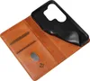 A brown leather flip cover wallet case for a smartphone is shown open, with the black inner phone holder detached and partially lifted. Produktbild-Vorschau