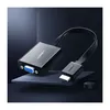 A Ugreen HDMI to VGA converter with a Micro USB and 3.5mm audio output is displayed on a dark, angled surface against a dark background. Voir les images du produit