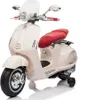 A white Vespa-style electric scooter for children, shown from a three-quarter front angle against a white background. Podgląd zdjęcia produktu