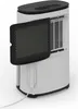 A white dehumidifier with its front filter panel open, revealing the internal components. A white power cord is visible at the bottom. Podgląd zdjęcia produktu