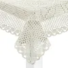 A close-up view of a crocheted tablecloth draped over a table corner. Náhľad obrázku produktu
