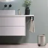 A modern bathroom setting with a vanity, sink, and accessories. Anteprima dell’immagine prodotto