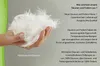 A hand holding a pile of white down feathers, with text describing the properties and types of down and feather fillings. Produktbild-Vorschau
