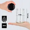 A hand holds a black lid above a clear glass jar, with another hand supporting the jar from below. Dimensions and weight are indicated by icons and text. Anteprima dell’immagine prodotto