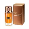 A bottle of Chopard Amber Malaki perfume and its packaging are displayed against a white background. Voir les images du produit