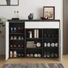 A modern shoe cabinet with multiple shelves and doors, displaying various shoes and decorative items. Anteprima dell’immagine prodotto