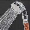 A close-up shot of a shower head with water spraying out. Produktbild-Vorschau