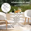 An outdoor scene with a white plastic table and two chairs on a patio. Produktbild-Vorschau