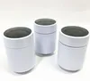 Three white cylindrical objects with gray tops are arranged on a white surface. Produktbild-Vorschau