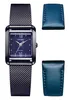 A square-faced women's watch with a mesh band and two blue leather straps, presented on a white background. Voir les images du produit
