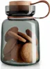 A glass jar filled with cookies, with a wooden lid and a leather strap. Náhled obrázku produktu