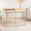 A wooden desk with a drawer and an open shelf, placed on a rug in a room with a sofa in the background. Produktbild-Vorschau