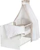 A baby crib with bedding and a canopy. Produktbild-Vorschau
