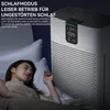 A woman sleeping in bed next to an air purifier. Produktbild-Vorschau