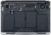 The internal components of a laptop, including the battery and motherboard, are visible. Produktbild-Vorschau