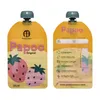 Two reusable food pouches shown side-by-side against a white background. The pouch on the left shows the front with strawberries and branding. The pouch on the right shows the back with usage instructions and website information. Náhľad obrázku produktu