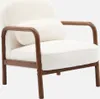 A cream-colored armchair with a wood frame. Produktbild-Vorschau