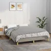 A bed with a gray blanket and pillows in a room. Produktbild-Vorschau