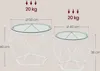 Two white geometric side tables with glass tops, shown with dimensions and weight capacity. Náhled obrázku produktu