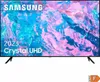 A Samsung Crystal UHD TV is shown on its stand, displaying a colorful abstract image on its screen. Produktbild-Vorschau
