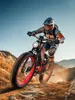 A person riding an electric mountain bike on a dirt trail. Produktbild-Vorschau