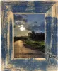 A rustic wooden picture frame with a landscape scene inside. Produktbild-Vorschau