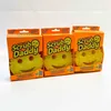 Three Scrub Daddy cleaning sponges in their original packaging are arranged side-by-side against a white background. Produktbild-Vorschau