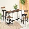 A bar table set with two stools in a home setting. Produktbild-Vorschau