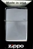 A Zippo lighter is displayed in its packaging against a black background. Podgląd zdjęcia produktu