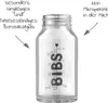 A clear glass baby bottle with measurement markings and brand logo, surrounded by descriptive text in German and arrows pointing to the bottle. Anteprima dell’immagine prodotto