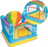 An inflatable bouncy castle with a rainbow and hot air balloon theme. Voir les images du produit