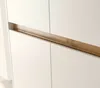 A close-up view of a white cabinet with a wooden handle. Produktbild-Vorschau