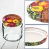 A collage of images showing a glass jar with a decorative lid featuring a vegetable pattern. Voir les images du produit
