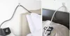 Two images showing CPAP hose holders attached to a wall above a bed, organizing the hose for a CPAP machine. Produktbild-Vorschau