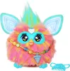 A fluffy, colorful toy with large eyes and ears, wearing a beaded necklace with a charm, and a small comb next to it. Podgląd zdjęcia produktu