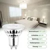 A bedroom scene with a bed, nightstands, and a ceiling light, with a close-up of an LED bulb in the foreground and product specifications listed on the right. Produktbild-Vorschau