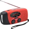 A red and black emergency hand-crank radio with an antenna and flashlight. Podgląd zdjęcia produktu