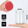 A hand holds a jar lid with a heart pattern, while another hand holds a glass jar with dimensions indicated. Information about weight and diameter is also shown. Anteprima dell’immagine prodotto