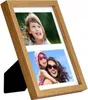 A wooden photo frame with two pictures, one of a young girl and another of a woman holding a child. Náhľad obrázku produktu
