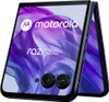 A folded Motorola Razr 50 Ultra smartphone is shown from the front, displaying its screen with a purple abstract wallpaper and the Motorola logo and product name. Náhled obrázku produktu