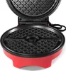 A close-up view of an open waffle maker with a Pokeball design. Podgląd zdjęcia produktu