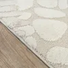 A close-up view of a rug with a giraffe pattern, showing the texture and design. Náhled obrázku produktu
