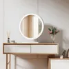 A white LED makeup mirror with a wooden vanity table and decorative items. Voir les images du produit