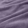 A close-up view of a soft, purple blanket with visible folds and texture. Anteprima dell’immagine prodotto